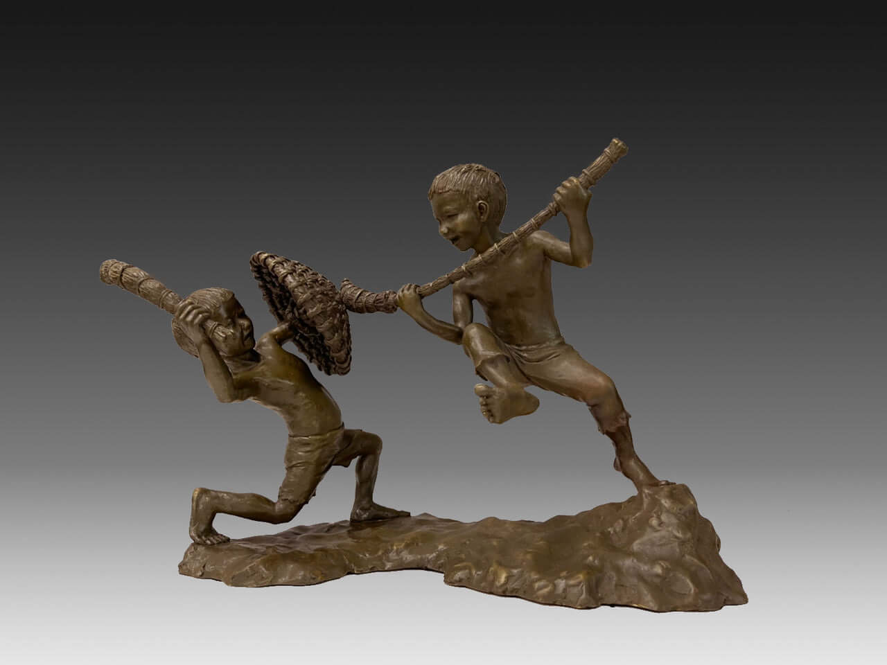 Bronze sculpture of two boys playing with straw swords and a shield, capturing childhood joy in 1950s Taiwan.